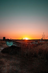 Scenic view of field against sky during sunset