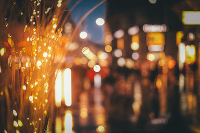 Defocused image of illuminated city street at night