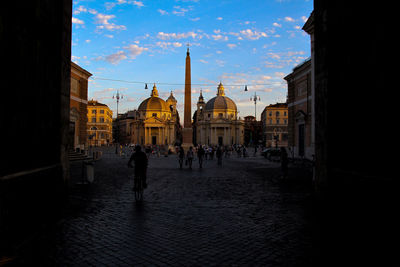 Entrance from piazzale flaminio to piazza del popolo in rome. overall view of the square at sunset.