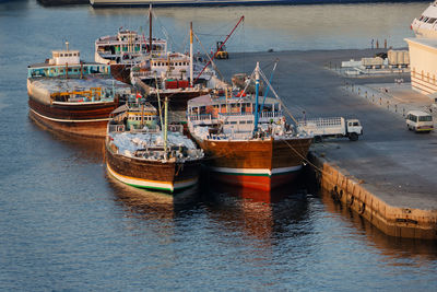 Boats moored at harbor