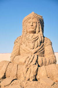 Low angle view of statue against sky