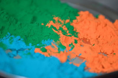Close-up of color powder in container