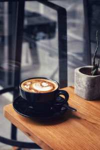 Close-up of coffee cup on table