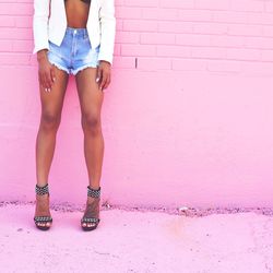 Low section of woman standing on tiled floor