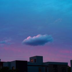 Low angle view of building against sky at sunset