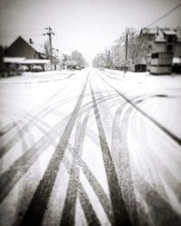 Close-up of snow covered railroad track