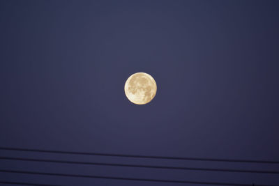 Low angle view of moon against sky at night