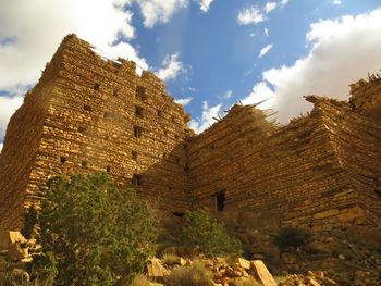 Low angle view of old building against sky