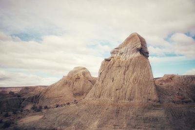 Rock formations in desert against sky