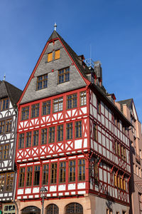 Traditional half-timbered house on romerberg square, frankfurt, germany