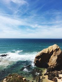 Scenic view of sea against blue sky