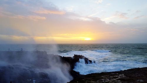 Scenic view of sea against sky during sunset