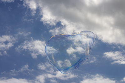 Low angle view of bubbles against sky