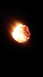 Close-up of fire in dark room