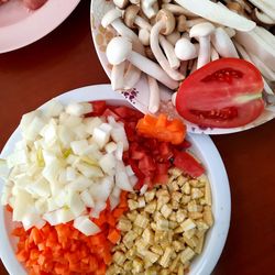 High angle view of chopped vegetables in bowl on table