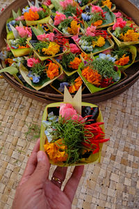 High angle view of hand holding flower bouquet