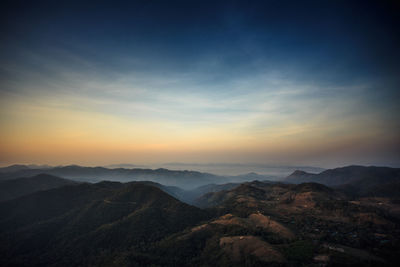 Scenic view of mountains against sky during sunset