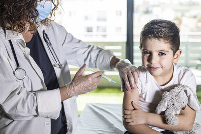 Little boy getting vaccinated from covid-19