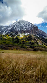 Scenic view of landscape and mountains against sky