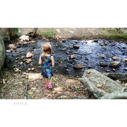 Full length of woman standing on rock