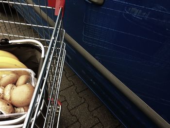 High angle view of mushrooms and bananas in shopping cart