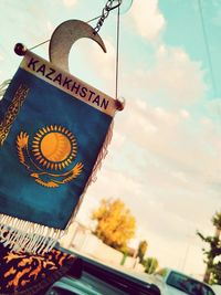 Low angle view of text on building against sky