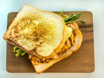 High angle view of bread on cutting board