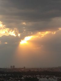 Scenic view of buildings against sky during sunset