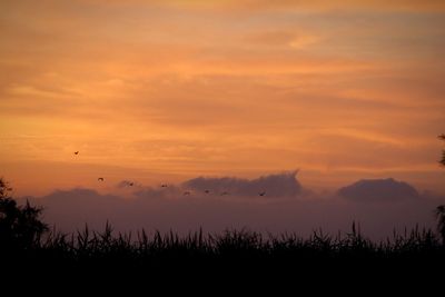 Scenic view of silhouette landscape against sky during sunset