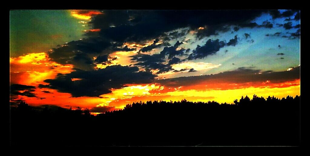 sunset, transfer print, silhouette, sky, scenics, orange color, beauty in nature, auto post production filter, tranquil scene, tranquility, dramatic sky, cloud - sky, nature, idyllic, cloud, moody sky, low angle view, majestic, dark, outdoors