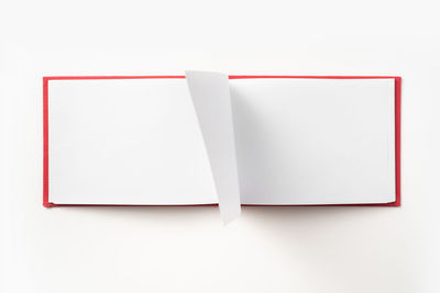 High angle view of paper over white background