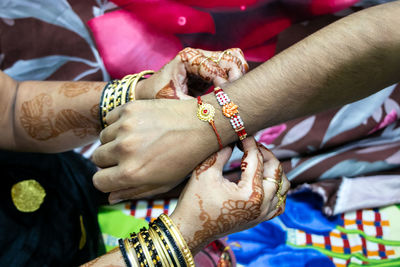 High angle view of people on hands