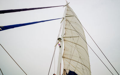 Low angle view of sailboat against sky