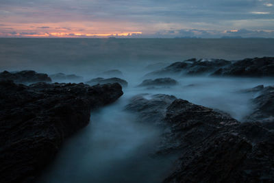 Scenic view of sea against sky during sunset