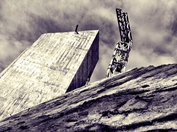 Low angle view of building against cloudy sky