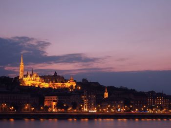 View of illuminated city at dusk