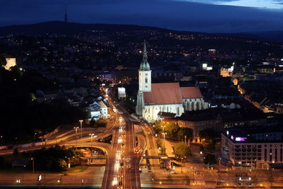 High angle view of road along built structures at night