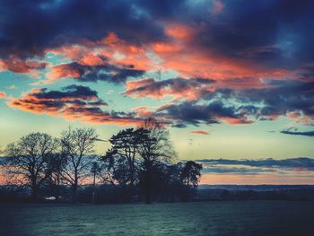 Scenic view of landscape against cloudy sky