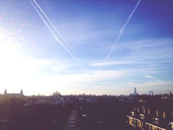 View of cityscape against blue sky