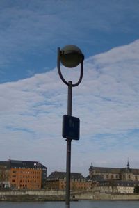 Low angle view of street light against sky