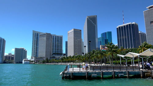 View of swimming pool against buildings in city