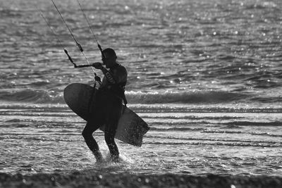 Woman standing by sea
