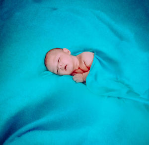 Boy sleeping in bed