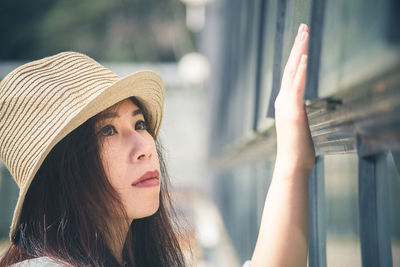 Close-up of young woman looking away