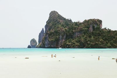 Scenic view of beach against clear sky