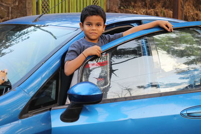 Portrait of boy in car