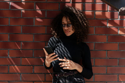 Young woman using mobile phone