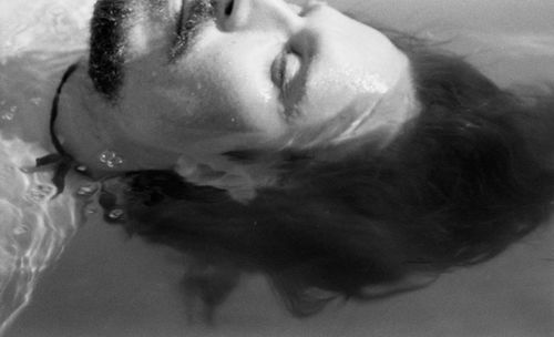 Close-up portrait of mid adult man in bathtub