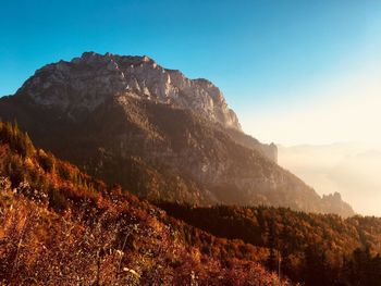 Scenic view of rocky mountains against clear blue sky