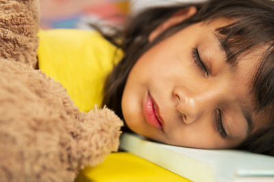 Portrait of girl sleeping at home